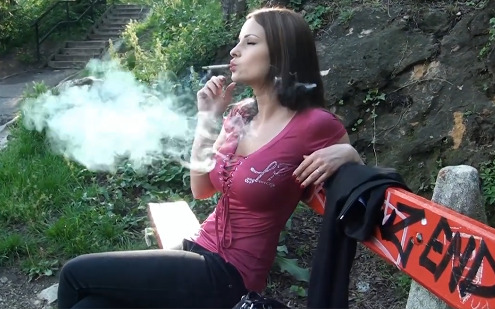 Abbie smoking in nature on bench