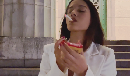 Angie outside smoking in public