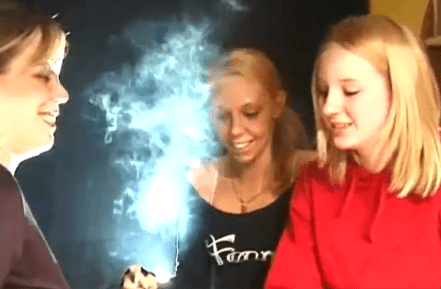 Bibi blowing smoke in her face