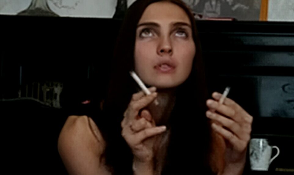 Brunette smoking multiple cigarettes