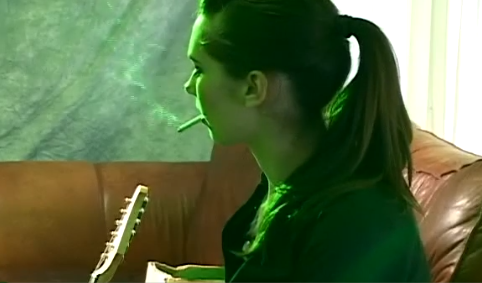 Candid girl smoking & playing some music