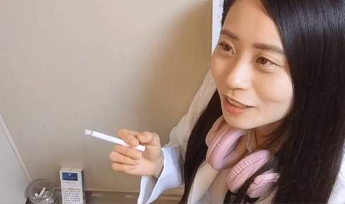 Asian Salesclerks Smoking during her work #1