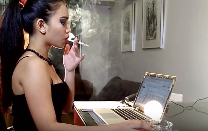 Doing her job with a dangling cigarette