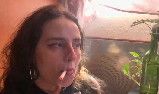 Heavy Smoker sucking from a Red Marlboro 100