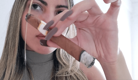 Hot Girl Puffing on a Cigar