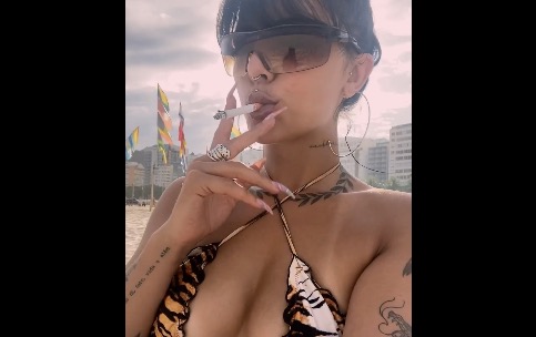 Intense Smoking Girl Cigarette at the beach