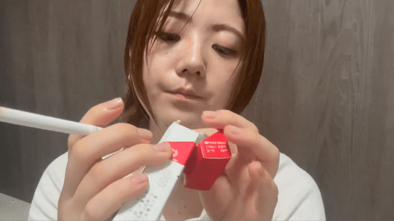 Japanese Girl Trying a strong Marlboro Red