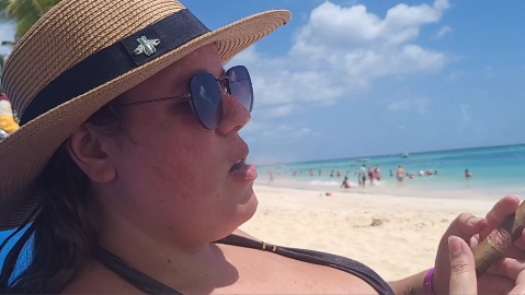 Lilli smoking a dominican cigar in caribbean