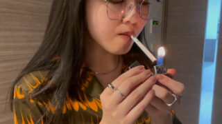 Asian Salesclerks Smoking during her work #2