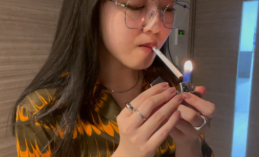 Asian Salesclerks Smoking during her work #2