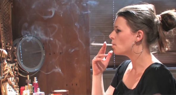 Doing her Make up and Smoking