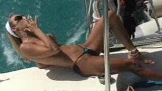 Milking a cig topless on a yacht
