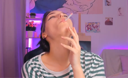 Sweet girl playing tricks while Smoking with a lot of Pleasure