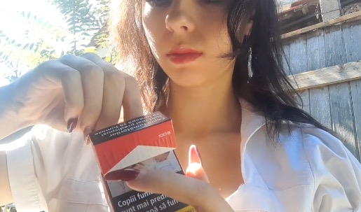Trying Marlboro red cigarette