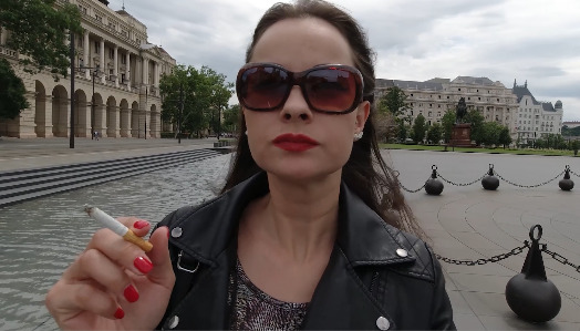 Abbie Walking and Smoking in the street of Budapest