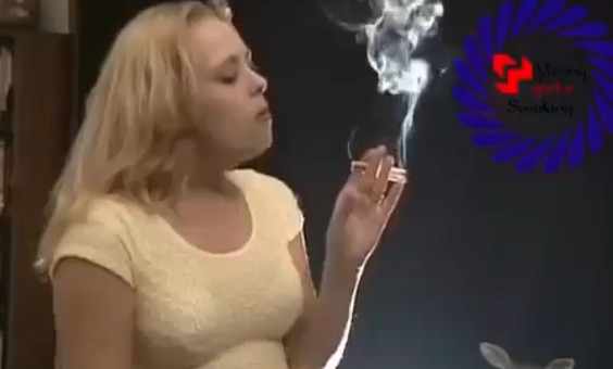 Sarah smoking two cigarettes at once
