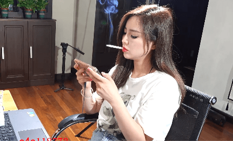 Sexy asian smoking girl hand free play game